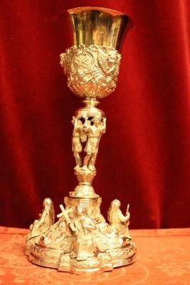 Exceptional Chalice With Paten And Original Case. Weight: 954 Gram.3  Silver Images As Nodus And Full Silver Imaginations Of Faith, Hope And Love On The Base. style Baroque en full silver, 19th century ( anno 1840 )