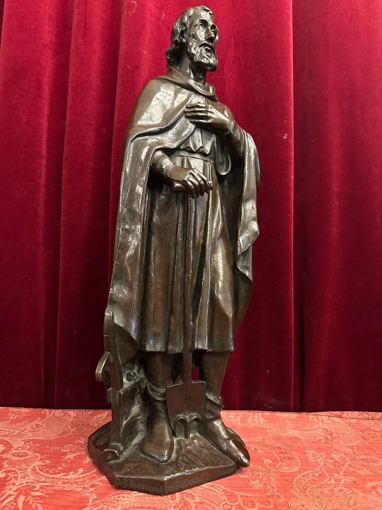 1 Gothic - Style St. Isidore Statue With The Dedication: 'De B. Boerenbond Aan J. Helleputte Zijnen Hoofddeken Den 29 April 1906'.