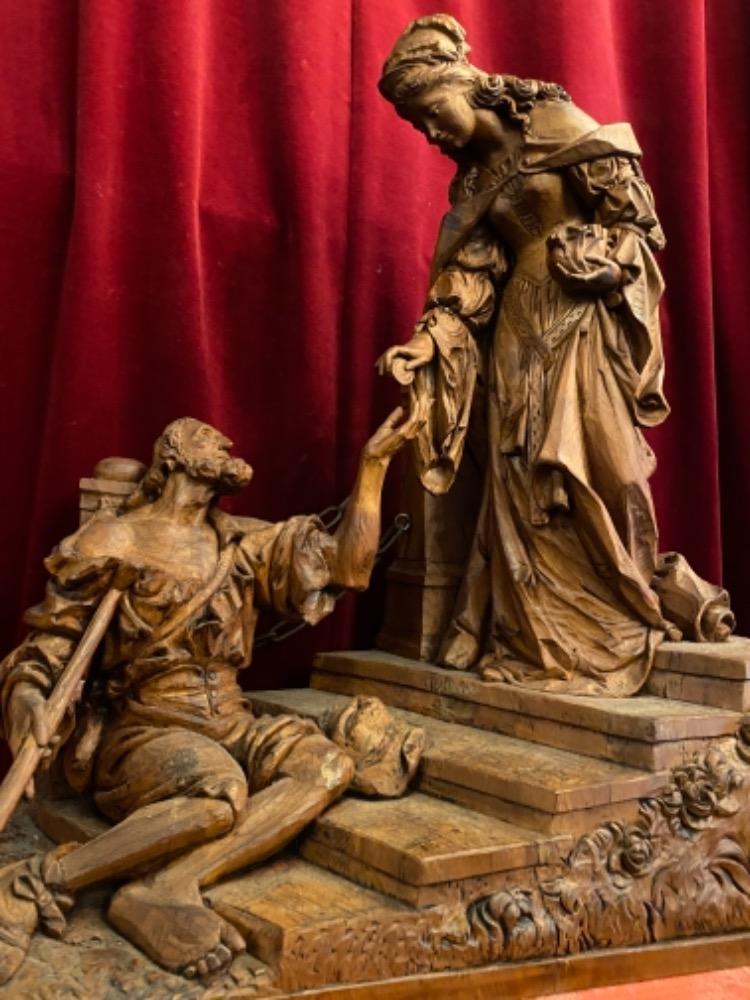 1 Gothic - style Wood Carved Statue Of Saint Elizabeth Giving A Coin With Her Right Hand To The Left Hand Of Beggar As Charity Gesture